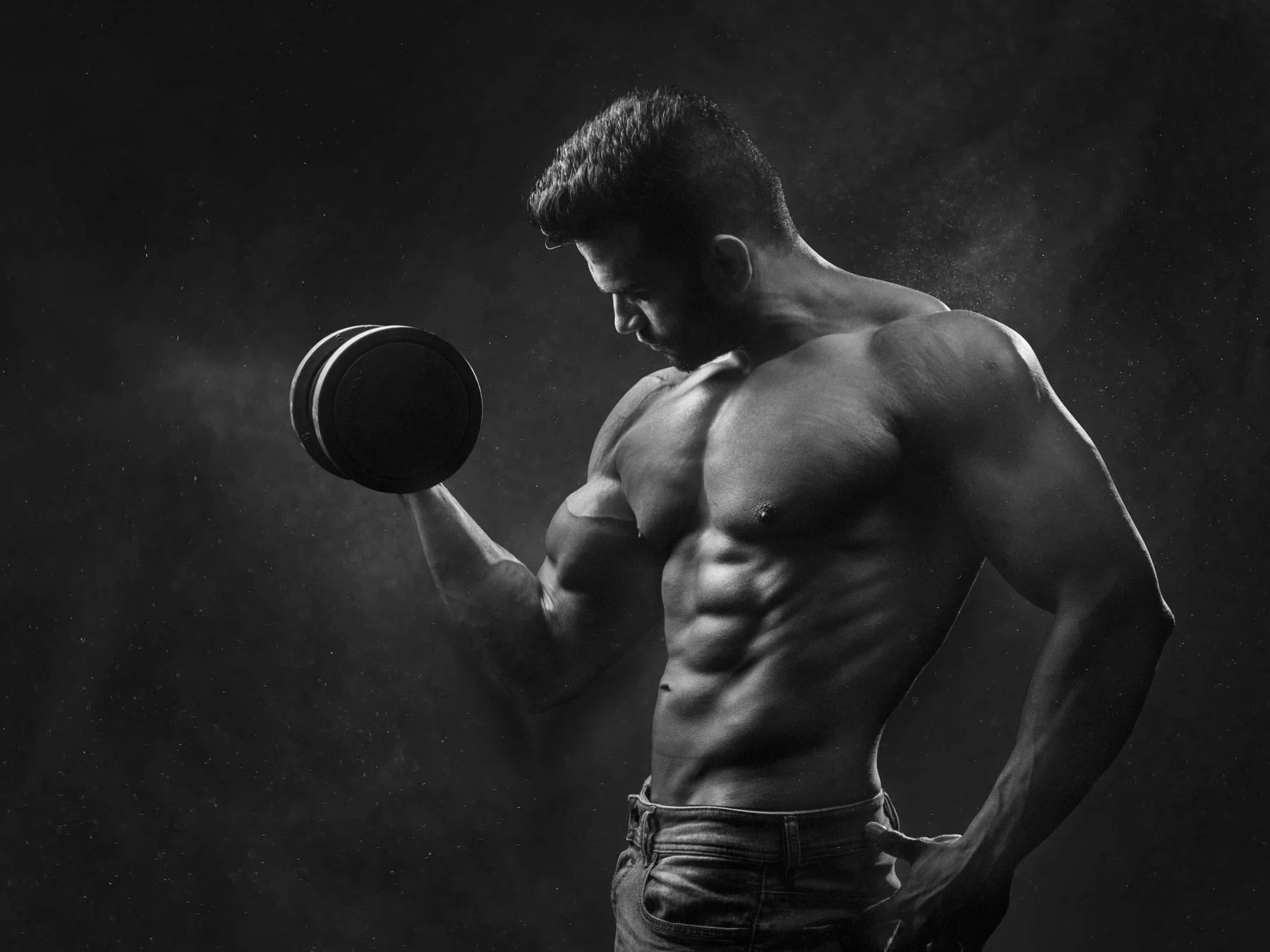 An athlete training with a dumbbell, illustrative Pexels photography