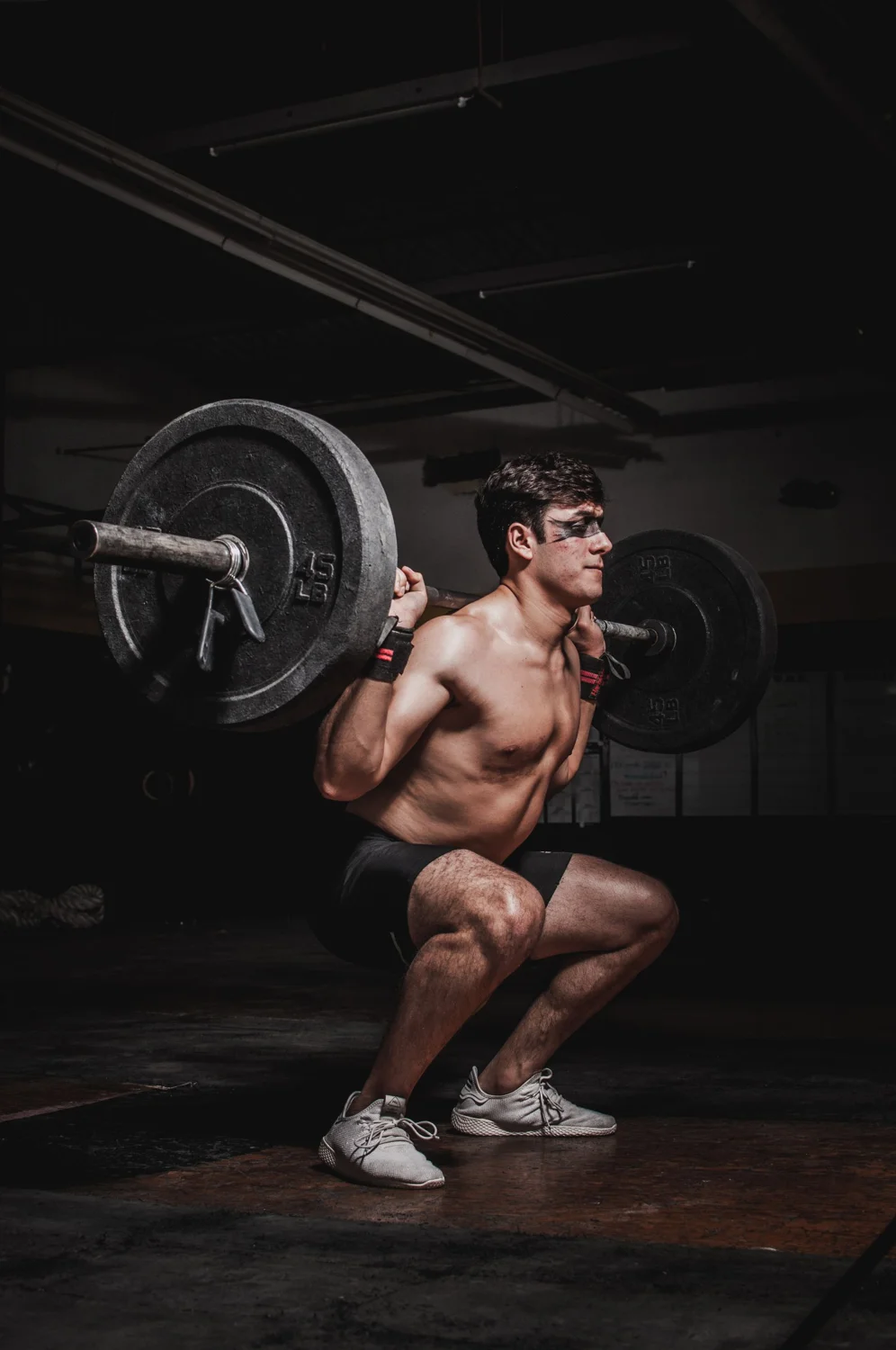 An athlete performing a barbell squat